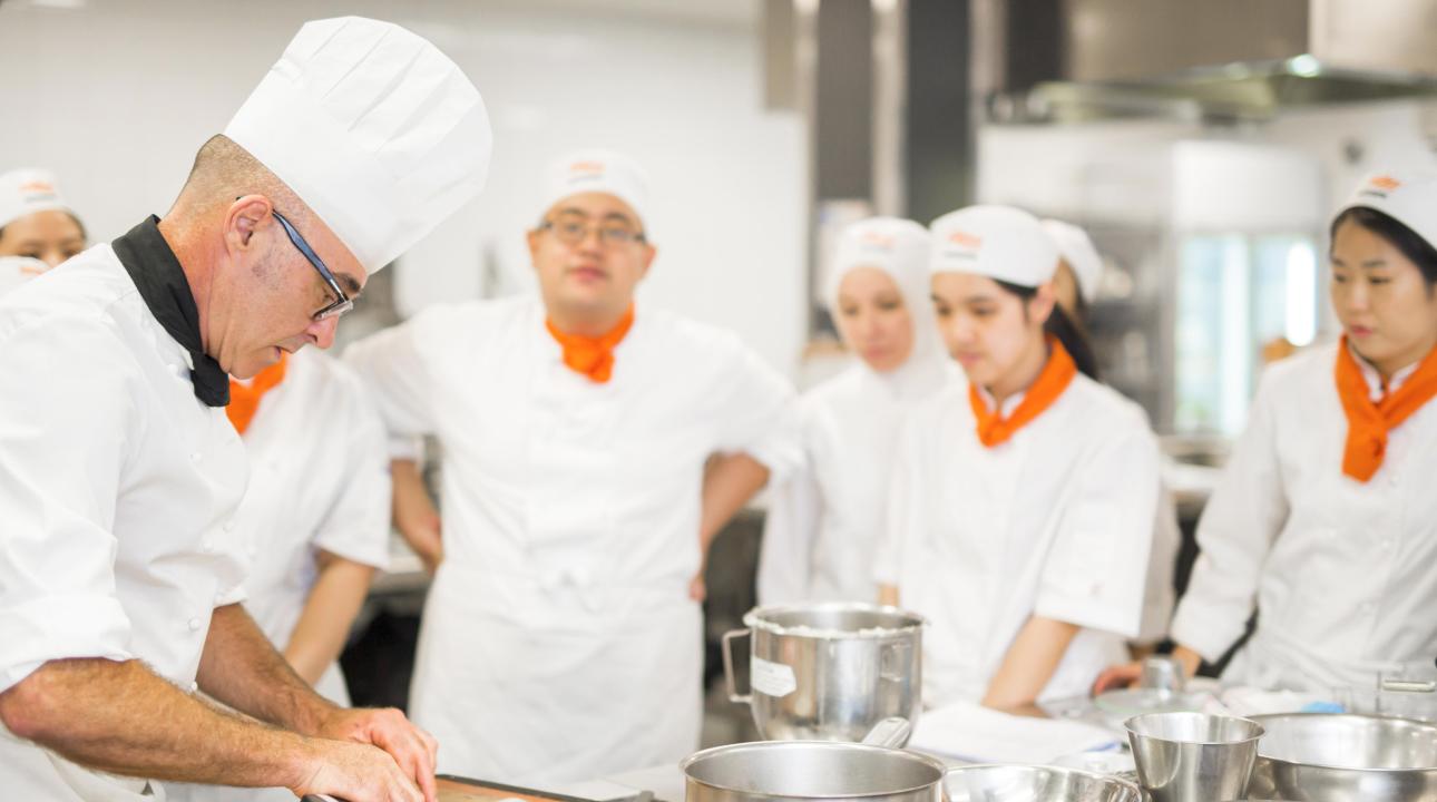 Chefs meeting in a kitchen