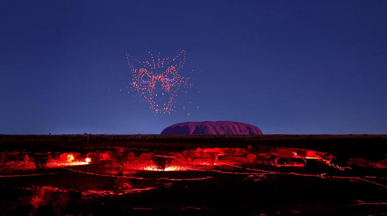 wintjiri wiru kurpany over the outback landscape in front of uluru