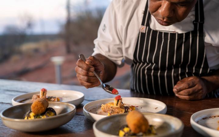 Tali Wiru chef preparing entrees