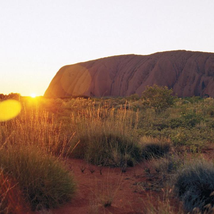 sunrise behind Uluru