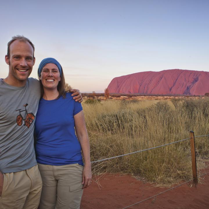 couple in front of Uluru