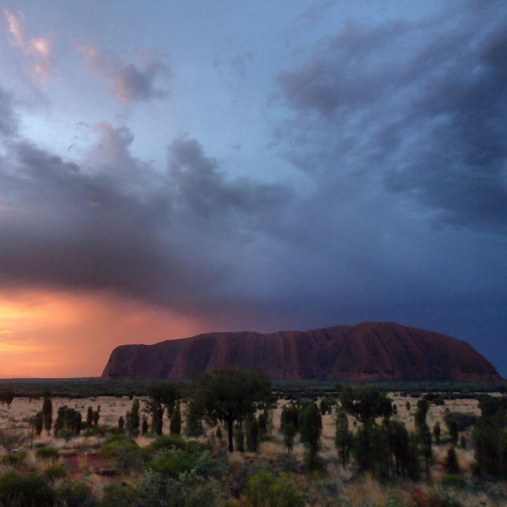 Sun setting behind Ayers Rock