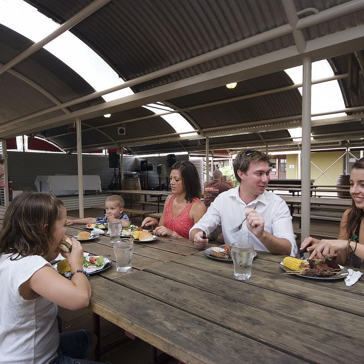 A family enjoys an assortment of food at the Ayers Rock Resort