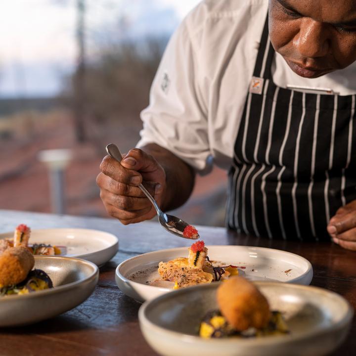 Tali Wiru chef preparing entrees