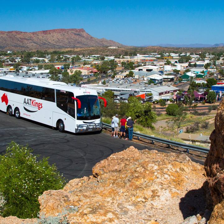 AAT Kings Coach overlooking Alice springs on a hill