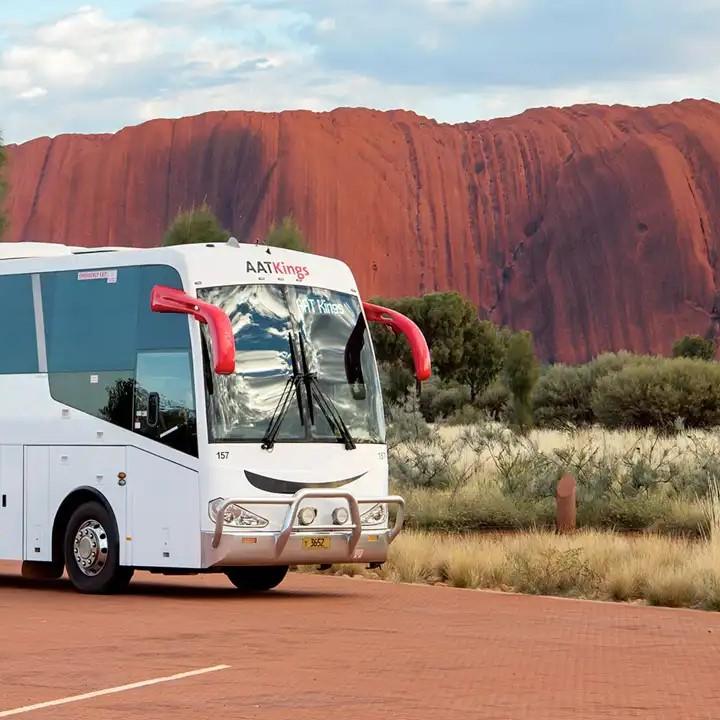 AAT Kings Coach in front of Uluru