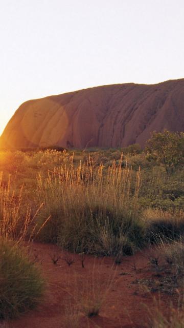 sunrise behind Uluru