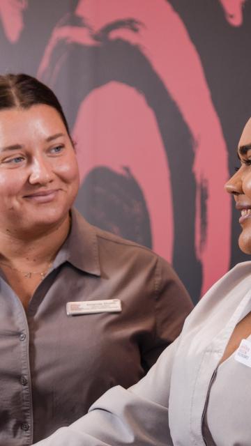 Two women smiling