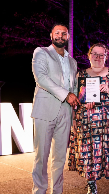 Kit Hawes receiving her award with Anthony Lew-Fatt from Cultural Journeys